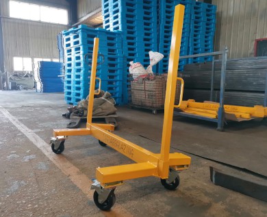 An employee comfortably using an ergonomic slab buggy to move glass panels
